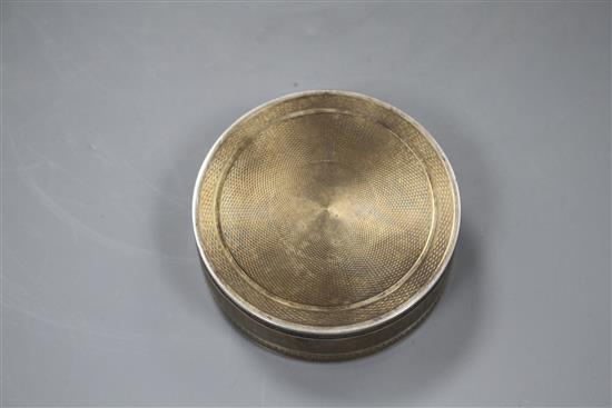 A late 19th/early 20th century French engine turned 950 standard white metal circular box and cover,